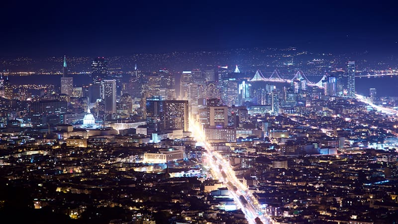 Nighttime view of the Silicon Valley skyline, illuminated by the lights of tech headquarters and bustling activity. This image symbolizes Silicon Valley's role as a global leader in technology and innovation, highlighting its contributions to executive leadership, development leadership, and advanced training programs. The skyline reflects the dynamic growth and collaborative environment that foster team building, executive development, and leadership training, essential for pushing the boundaries of Artificial Intelligence and technology.